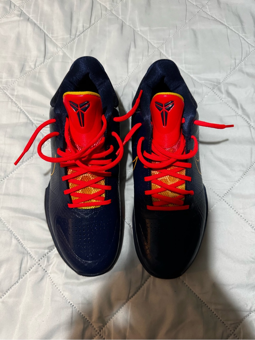 Nike Kids Navy Sneakers with Red and Yellow Accents